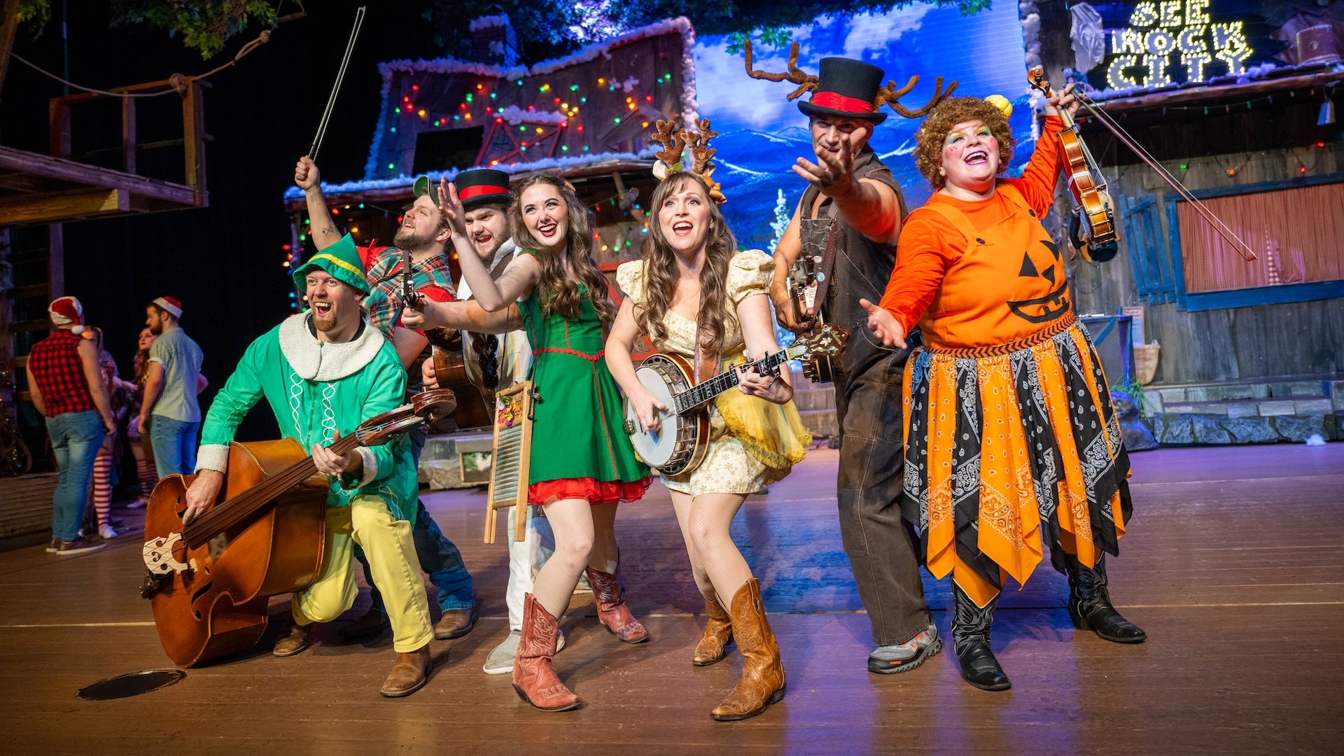 Group of singers on a stage in Christmas attire