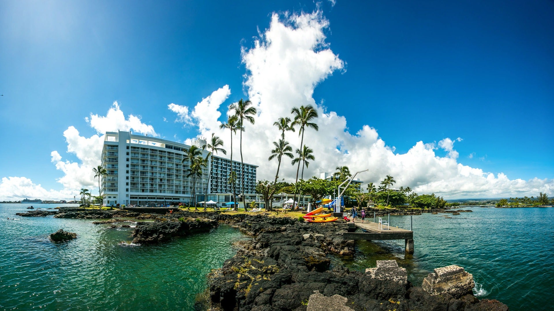 hotel with a view of the ocean and kayaks