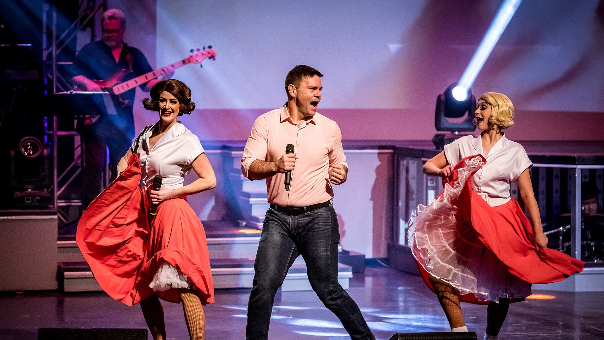 performers dancing on stage in costume