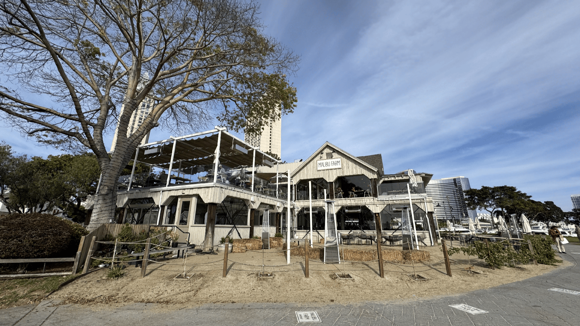 farmhouse looking restaurant with tree in front