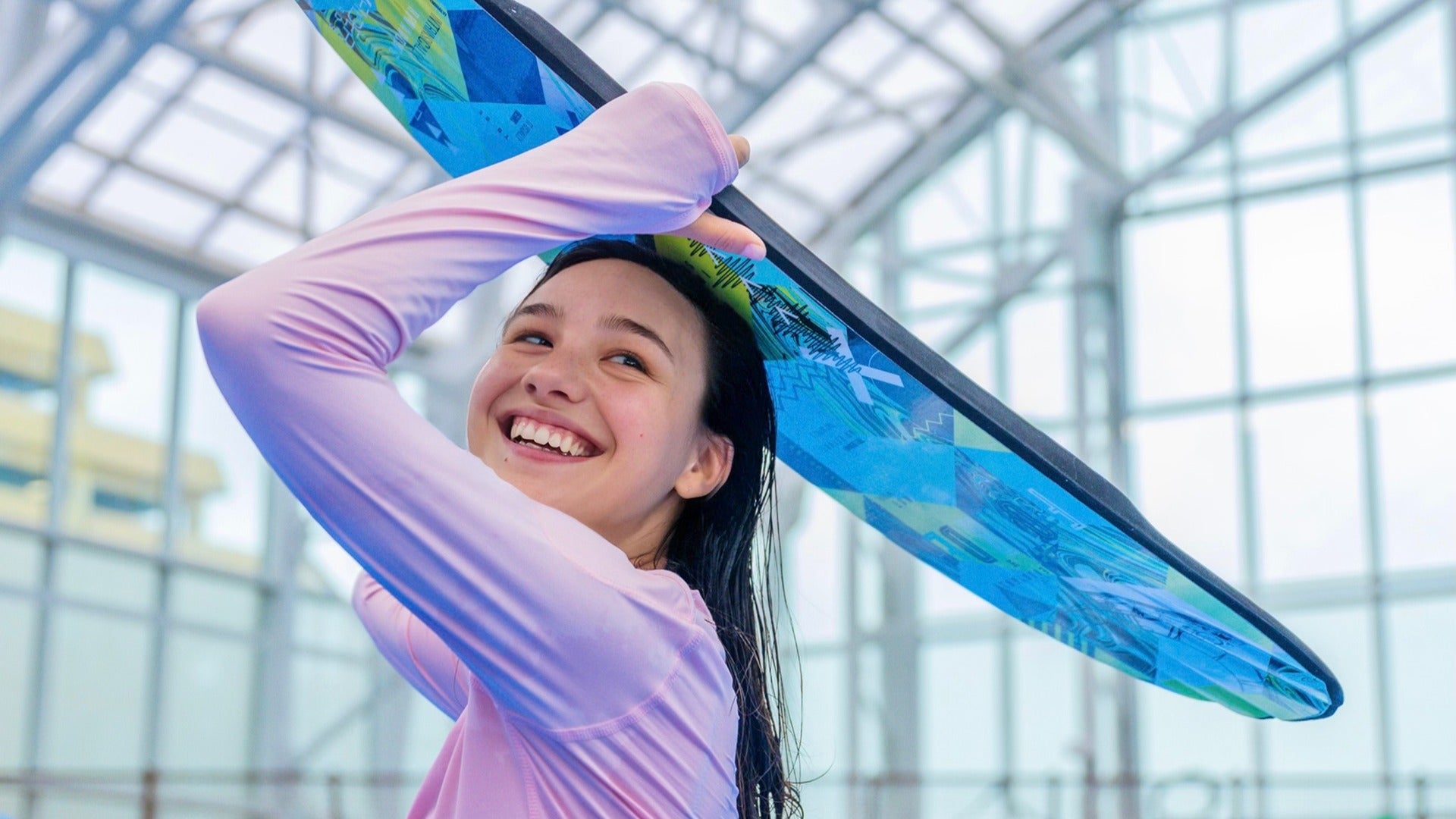 girl holding a surfboard