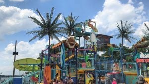waterpark with families and children playing on the slides