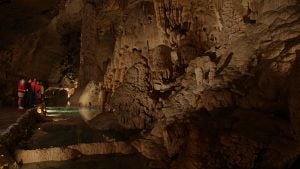people in a cave admiring rock formations