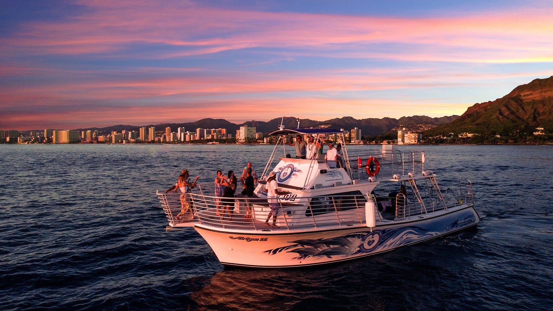 people enjoying a sunset cruise on the ocean
