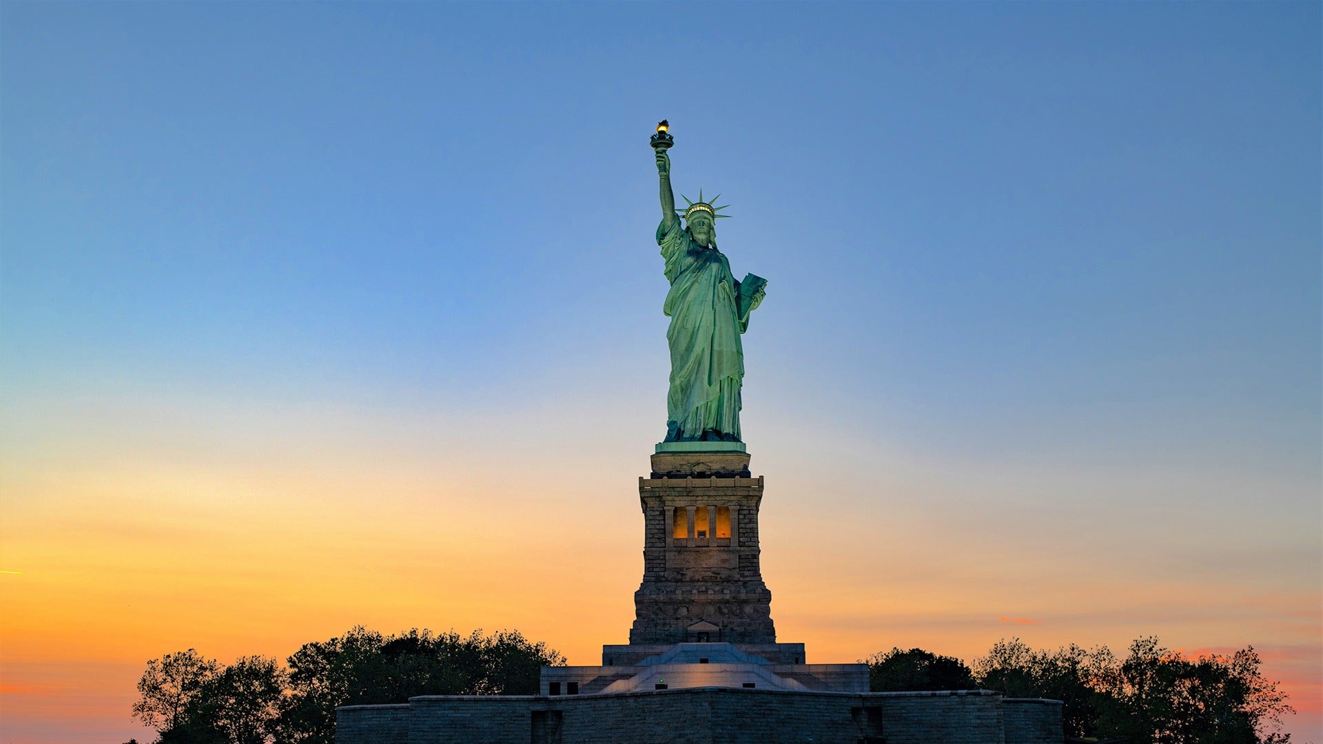 statue of liberty at sunset