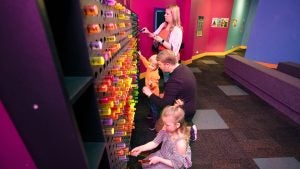 a family playing with an interactive wall