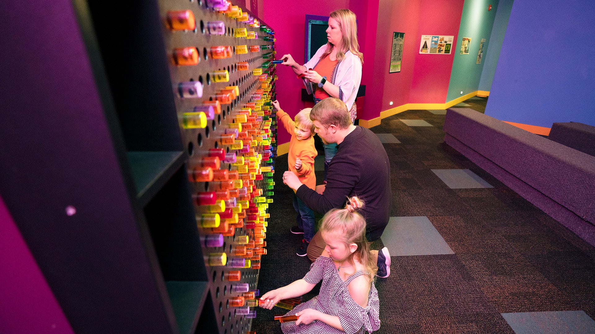 a family playing with an interactive wall