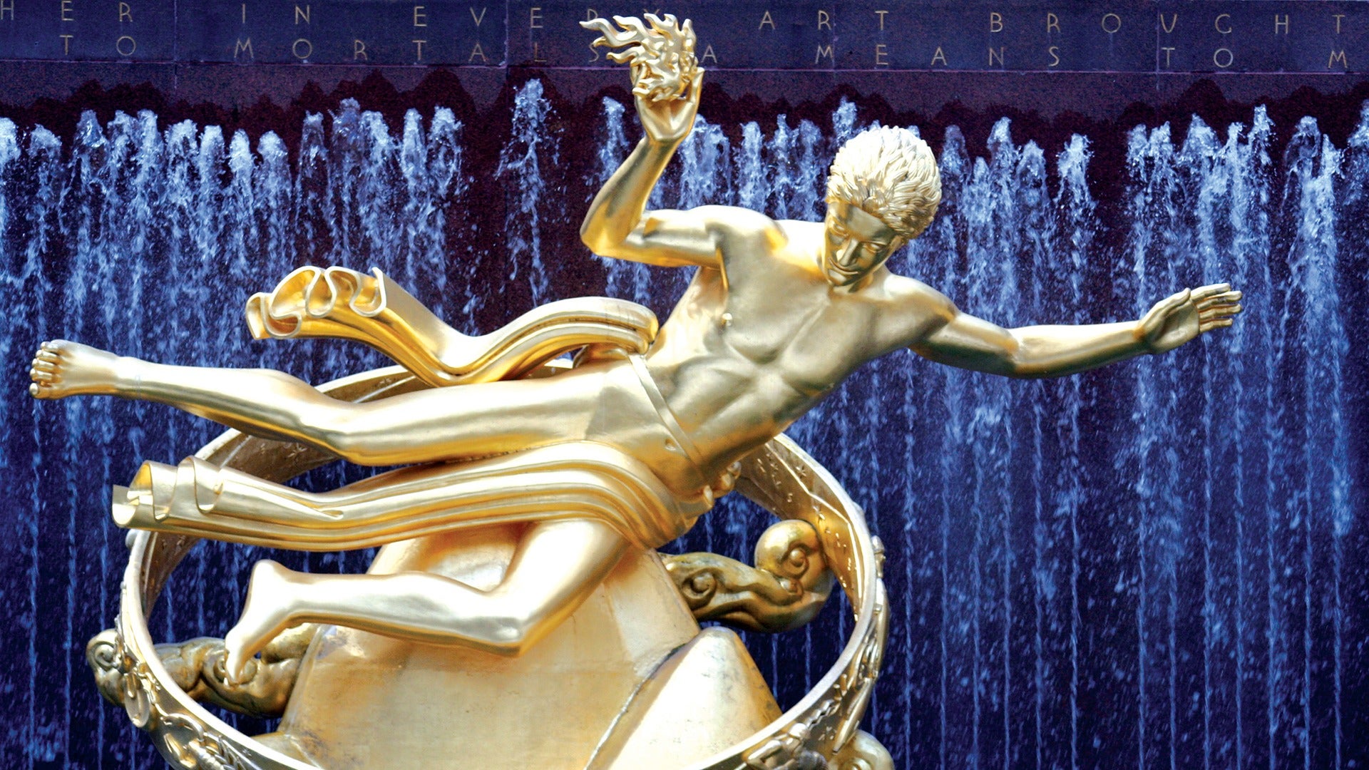 golden statue at rockefeller center