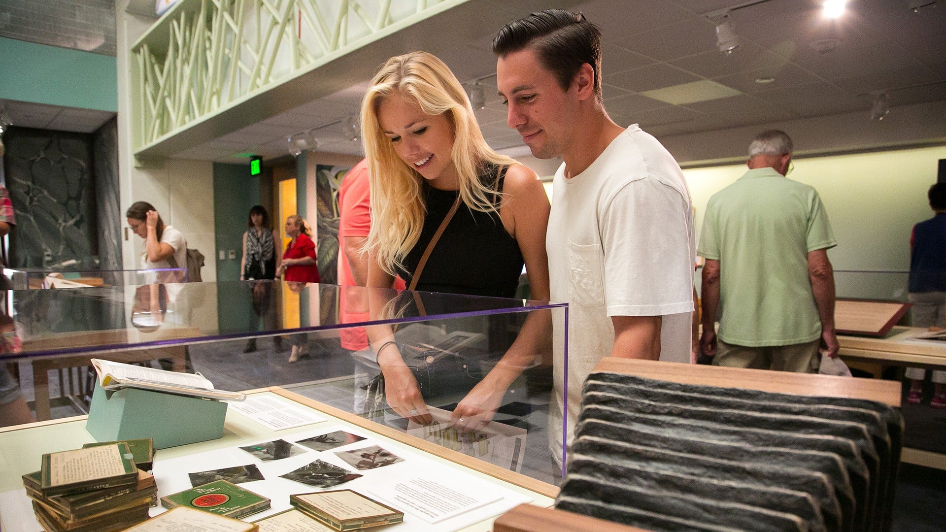 a couple looking at artifacts in a museum