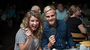 a couple holding magnifying glasses