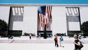 museum exterior with people walking around