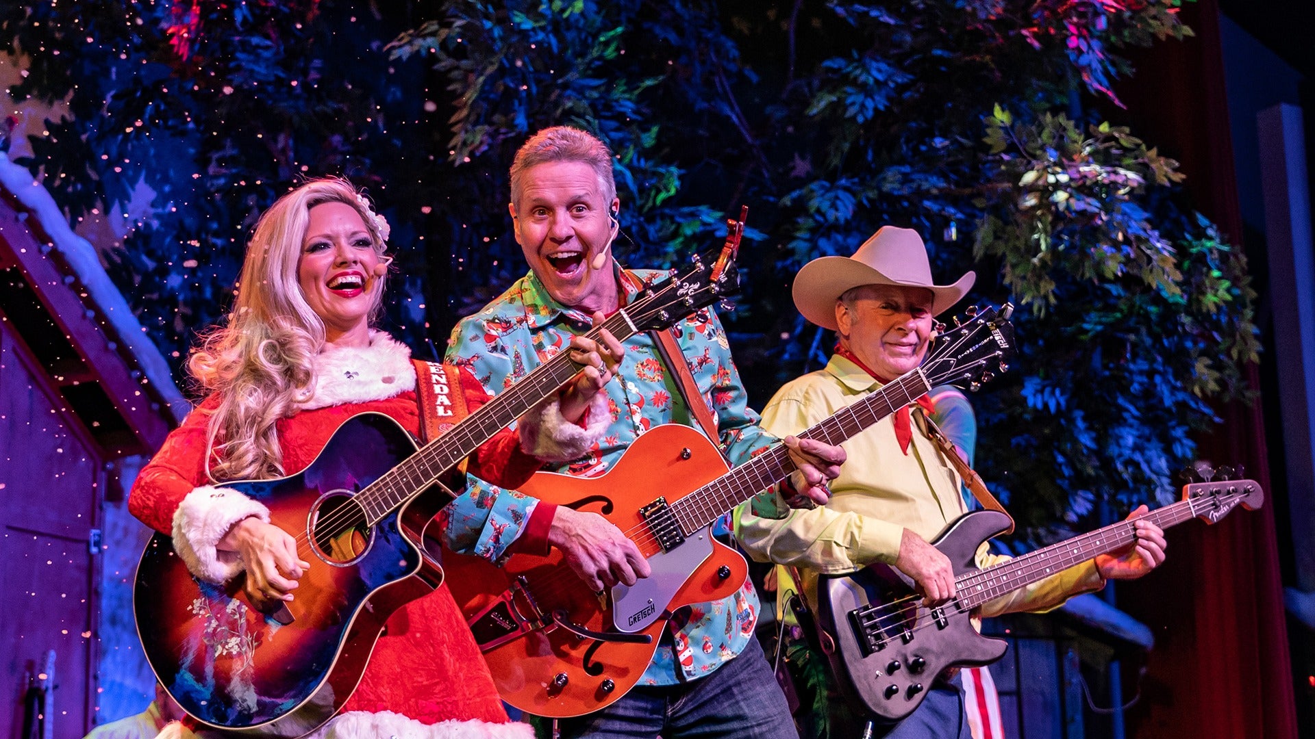 a group of performers holding instruments on stage