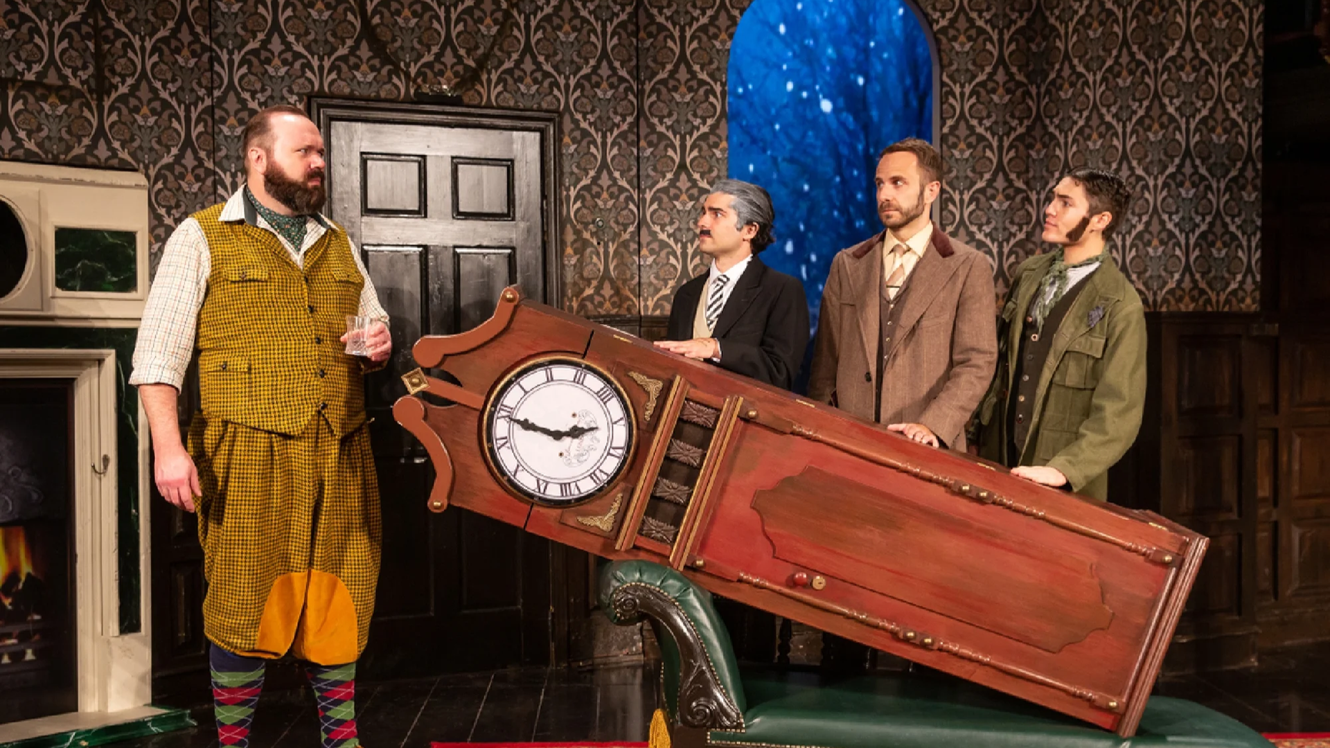 men in costumes on stage carrying a grandfather clock
