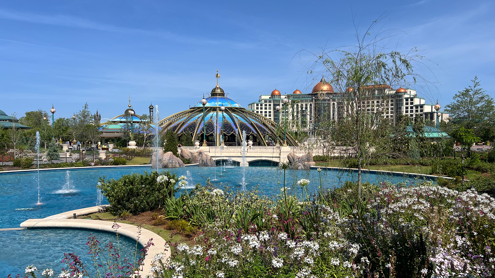 epic universe structure, water fountain and flowers