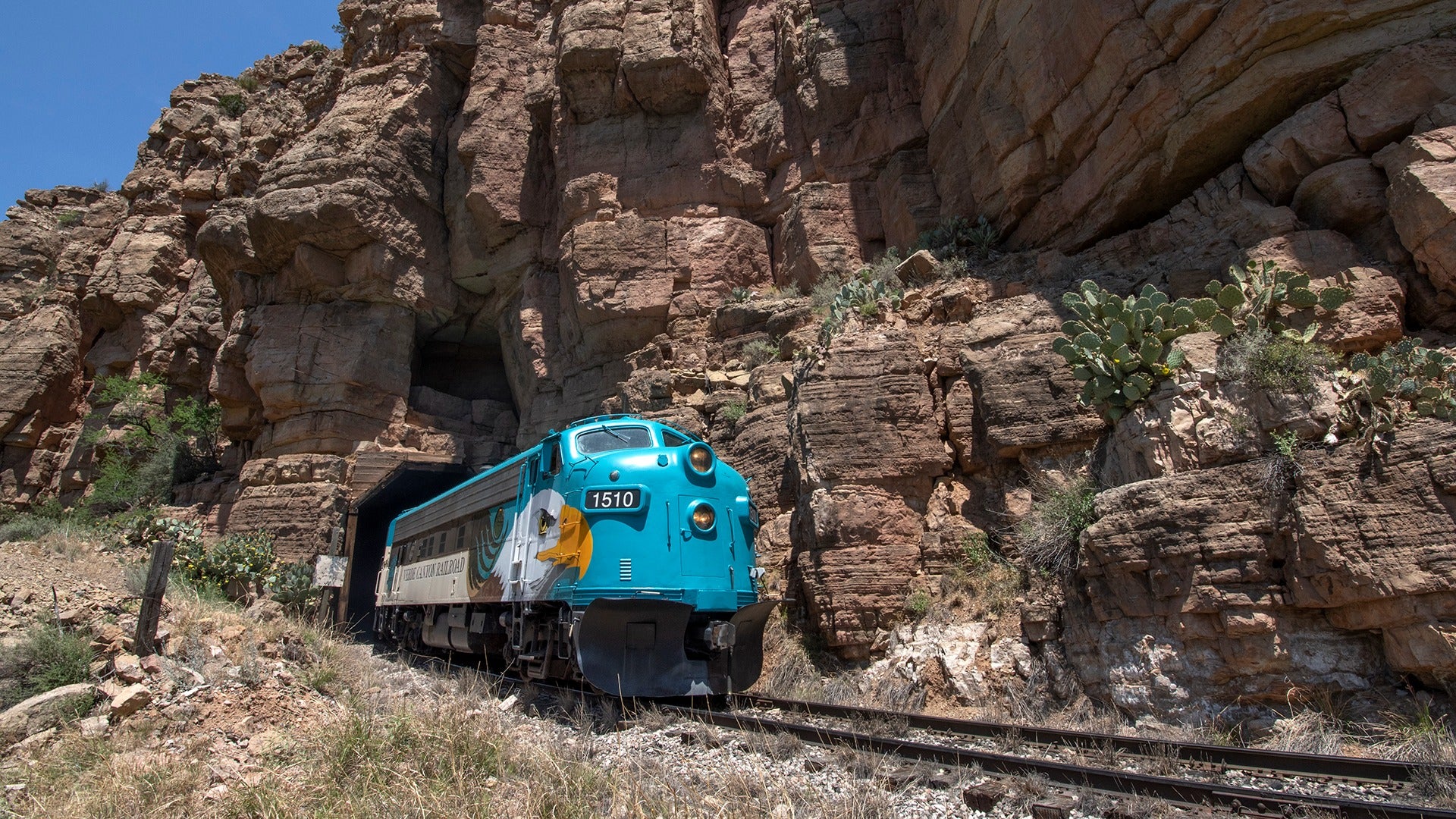train crossing though a mountain railroad