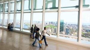 couple walking on a building observatory