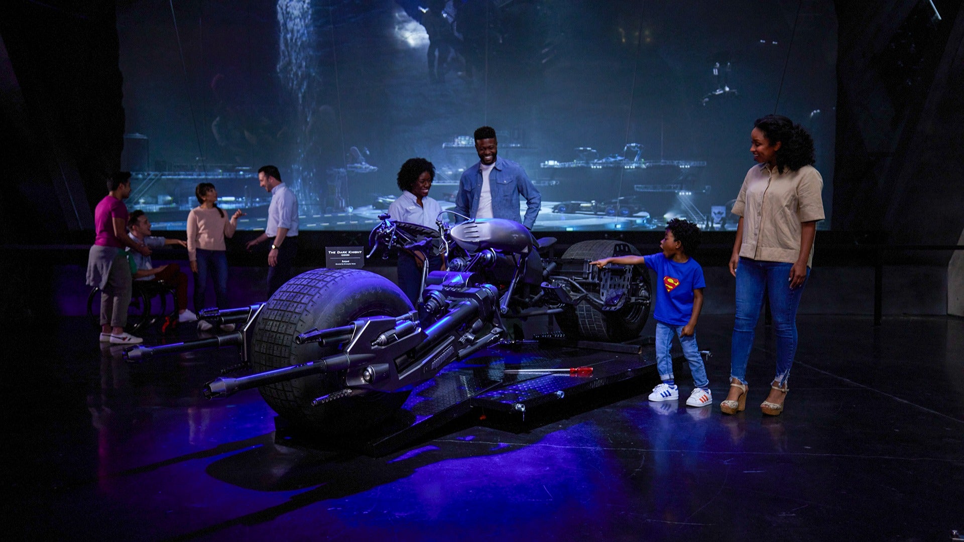 family admiring an exhibit in a museum