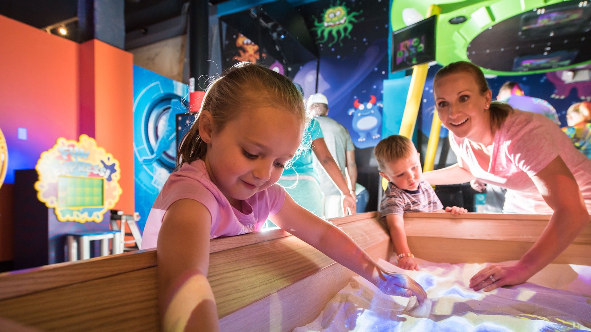 mother and child playing in an interactive exhibit