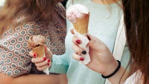 girls holding ice cream cones