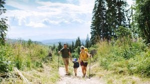 a family going on a hike in the mountains