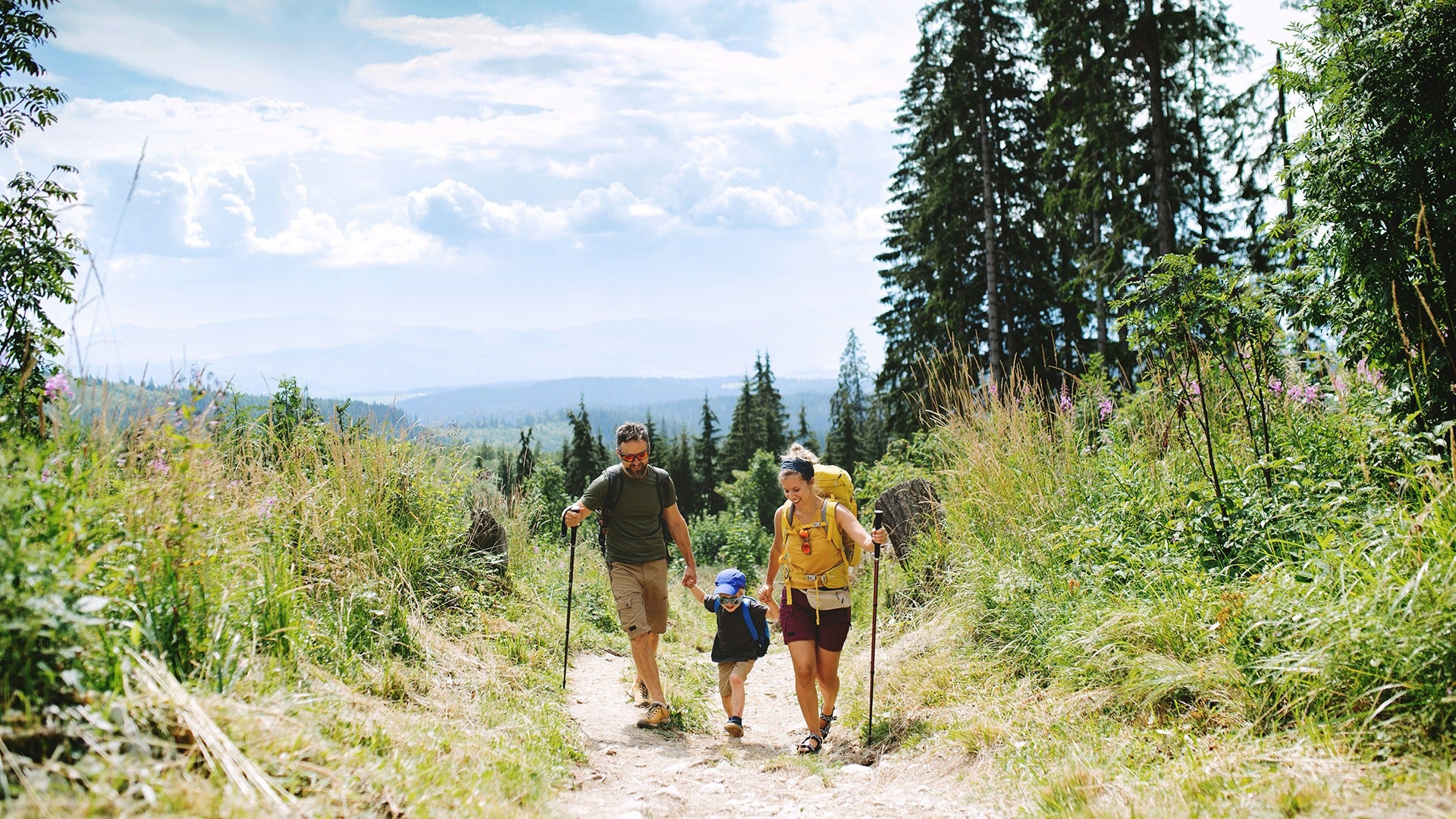 a family going on a hike in the mountains