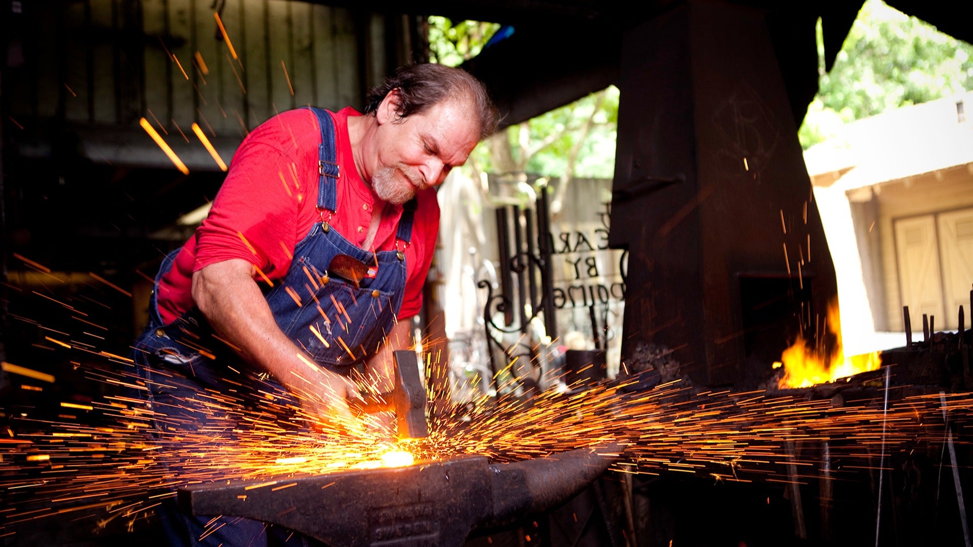 a man forging metal in dollywood