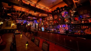 bar lounge interior with pirate decor, seating, and bartenders