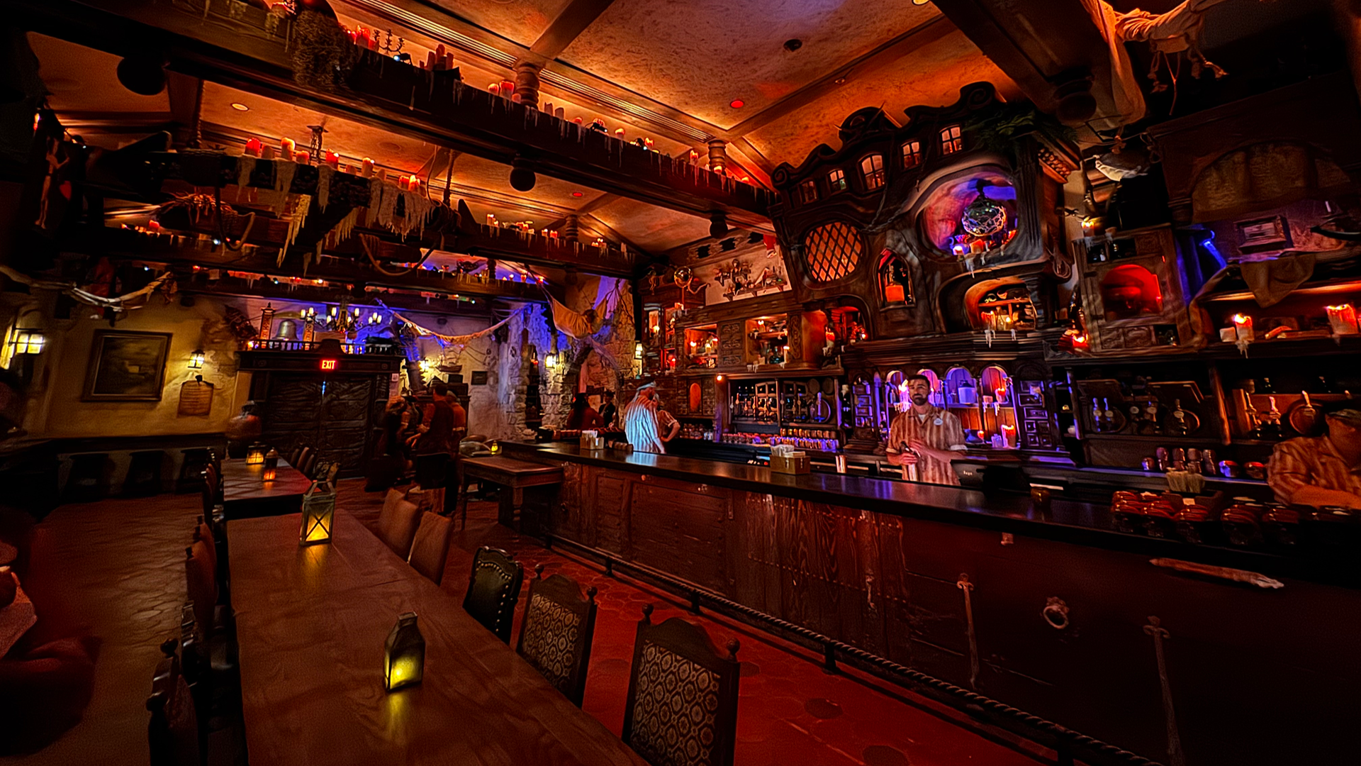 bar lounge interior with pirate decor, seating, and bartenders