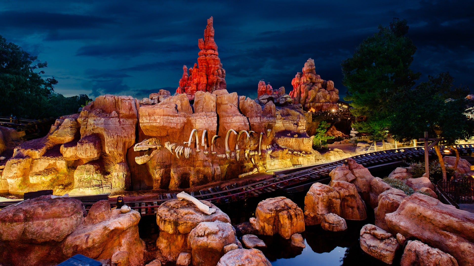 big thunder mountain amusement park ride with a railroad and lights
