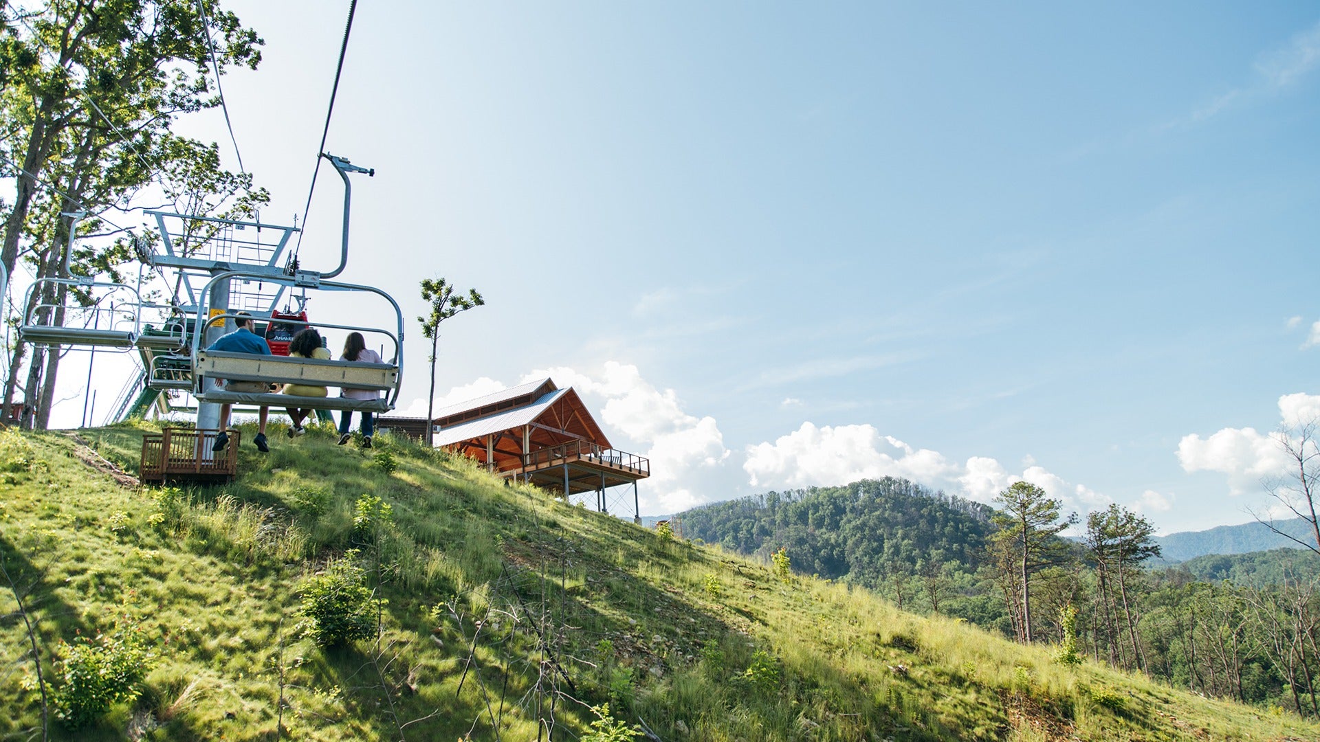chondola up a mountain with passengers on it