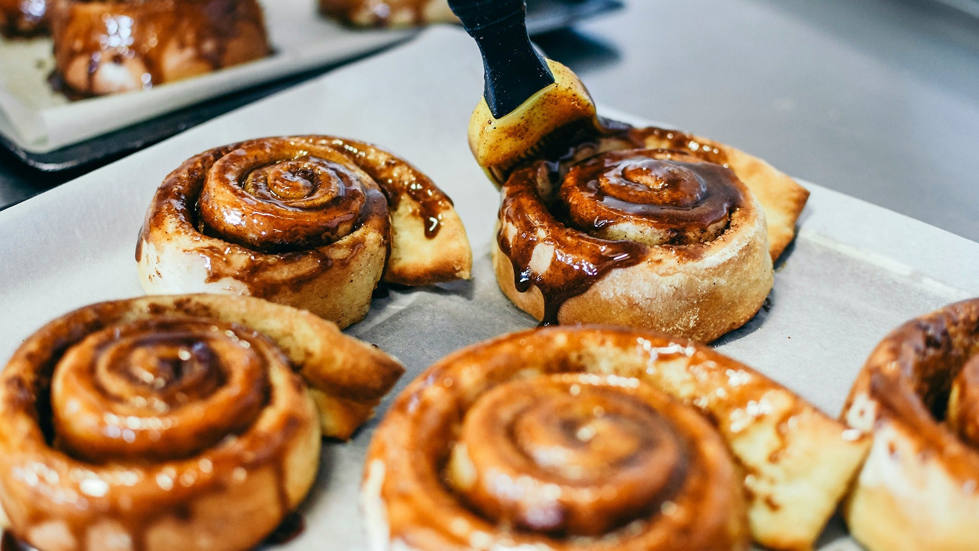 cinnamon rolls brushed with chocolate sauce