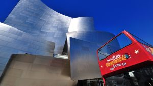 tour bus with a building at the back