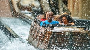Close-up of excited passengers at the peak of Daredevil Falls, after the dramatic drop