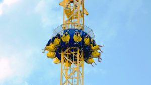 a group of people in a high flying ride