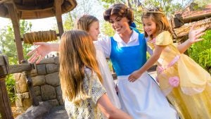 belle with kids in a disney meet and greet