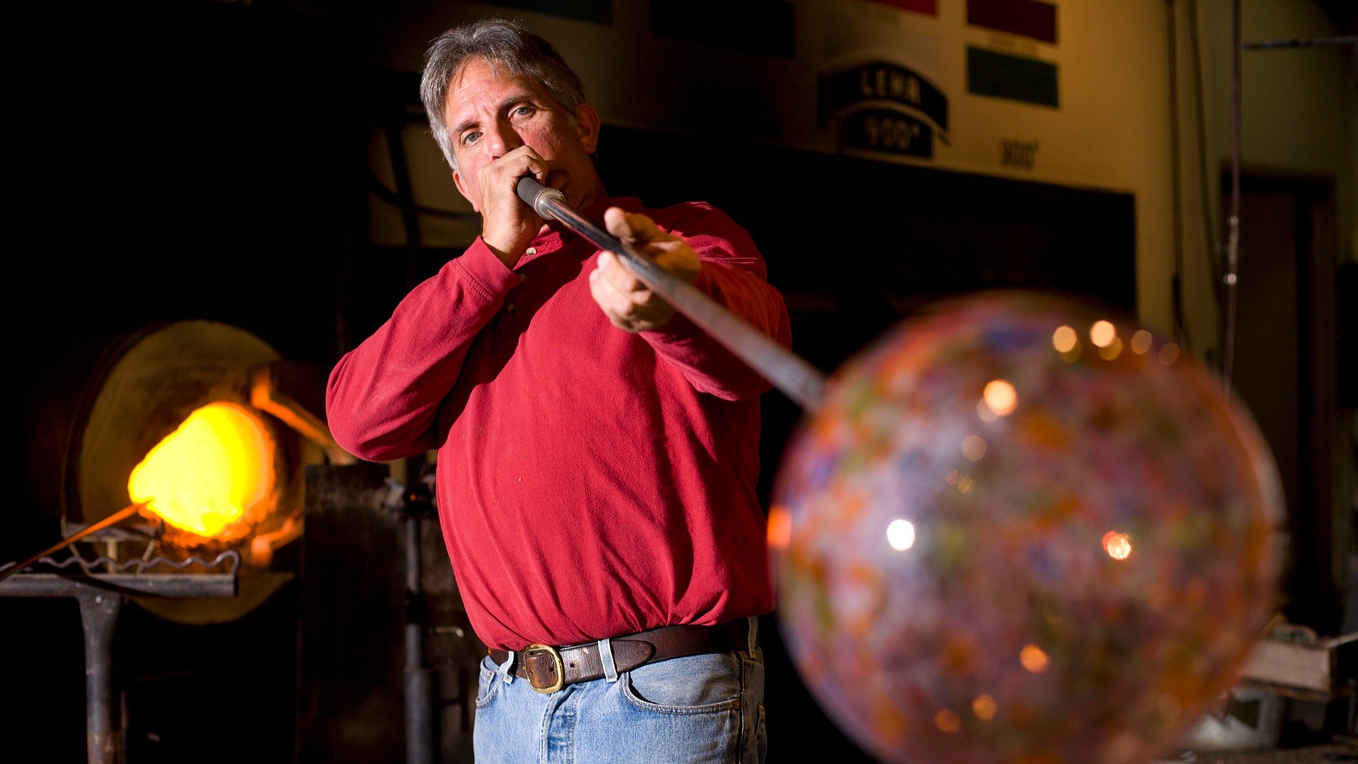 a man blowing glass at dollywood