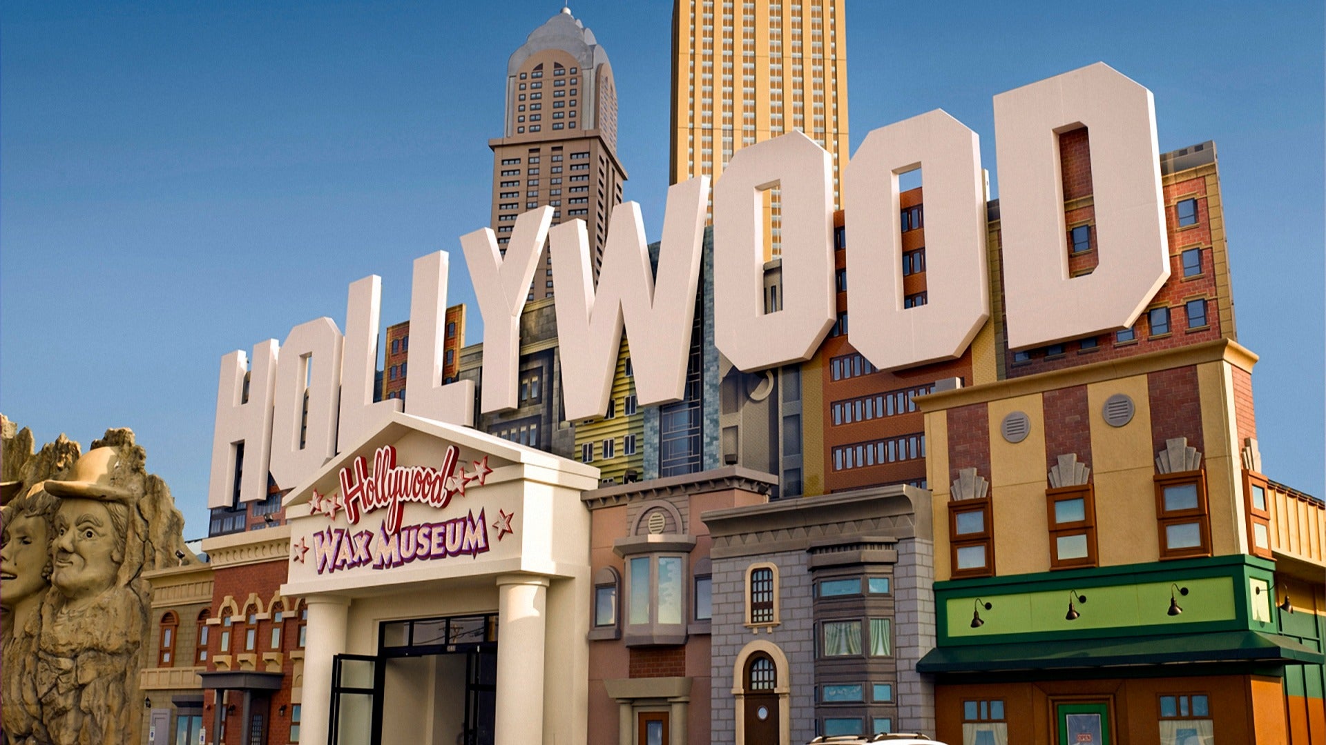 exterior of a hollywood museum with statues and a building at the back