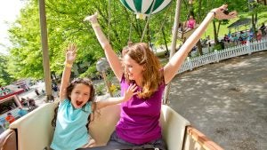 mother and child on a flying ride