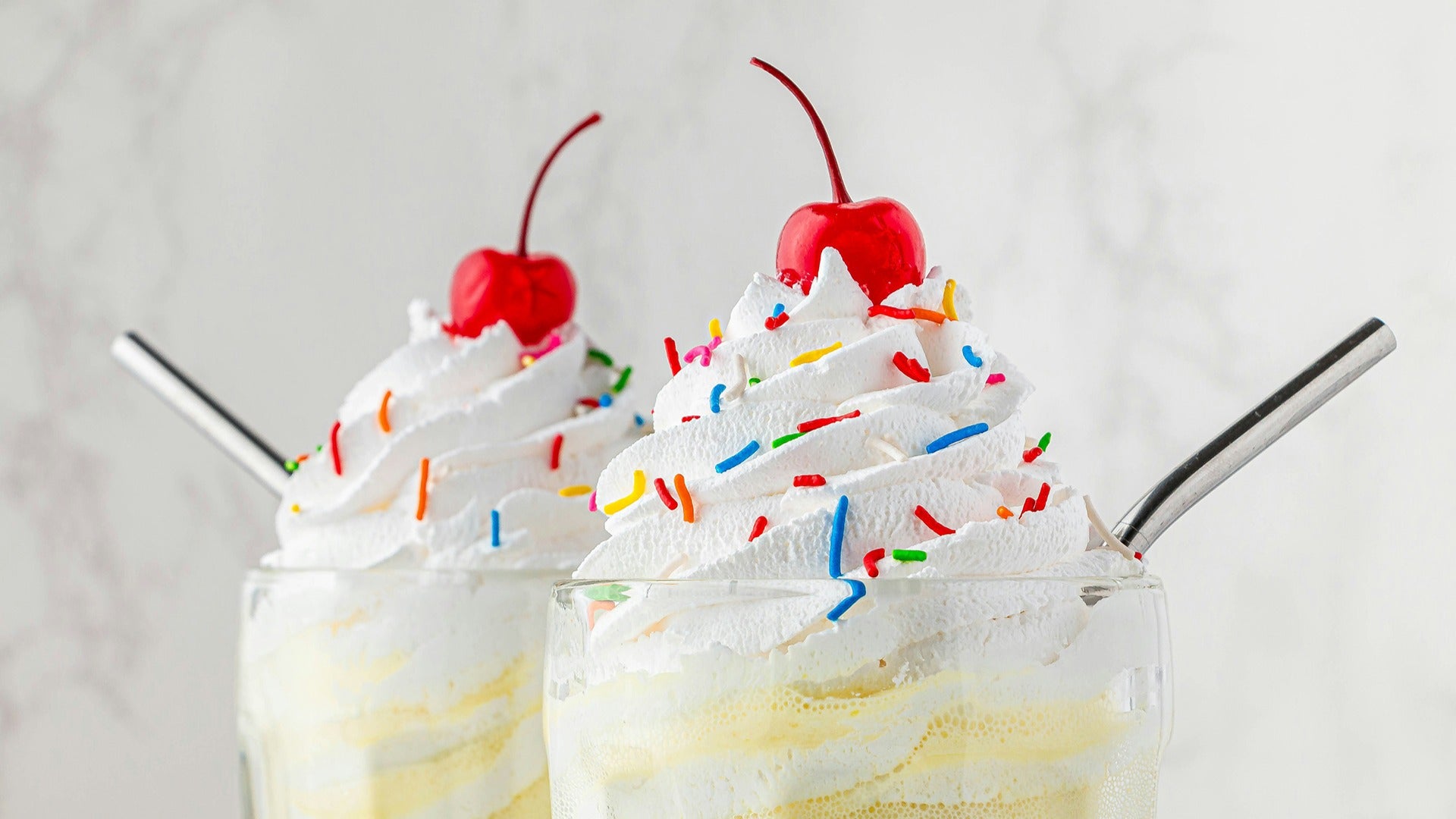 milkshakes with sprinkles and cherries on top