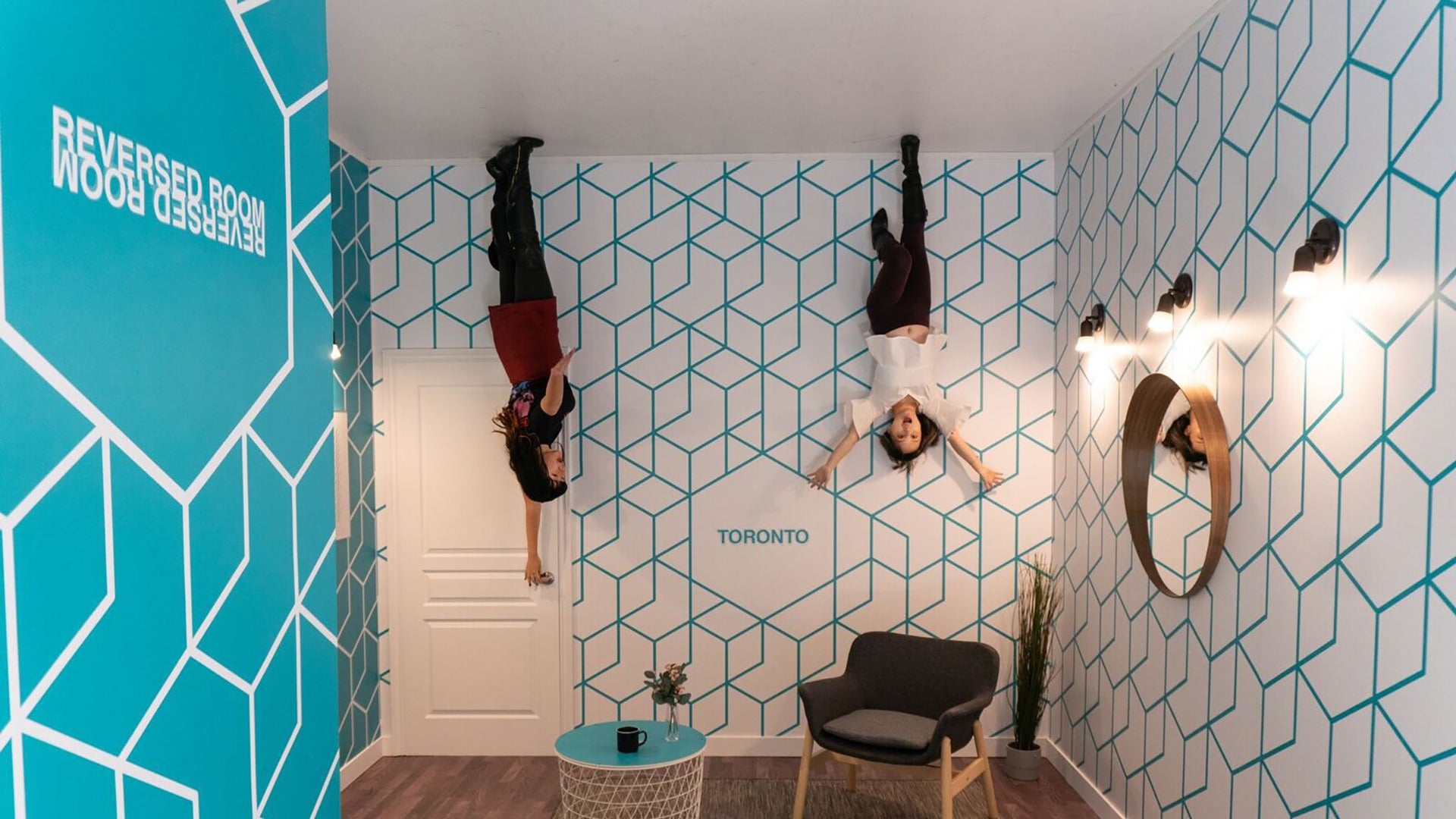 two women in an illusion reverse room