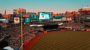 a stadium filled with people watching a baseball game