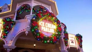 an ice cream shoppe decorated with holiday wreaths and lights