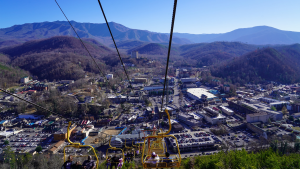 a chairlift showing views of Gatlinburg town below