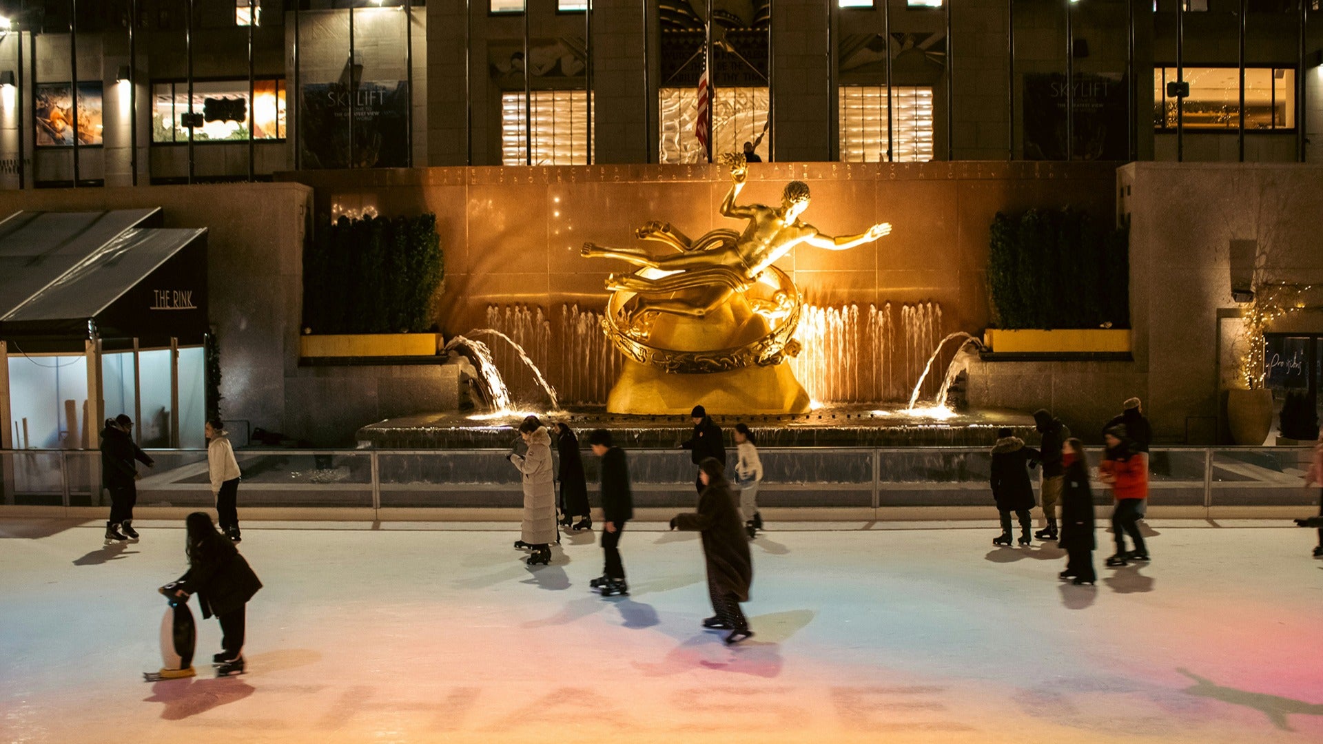 people ice skating on rockefeller center
