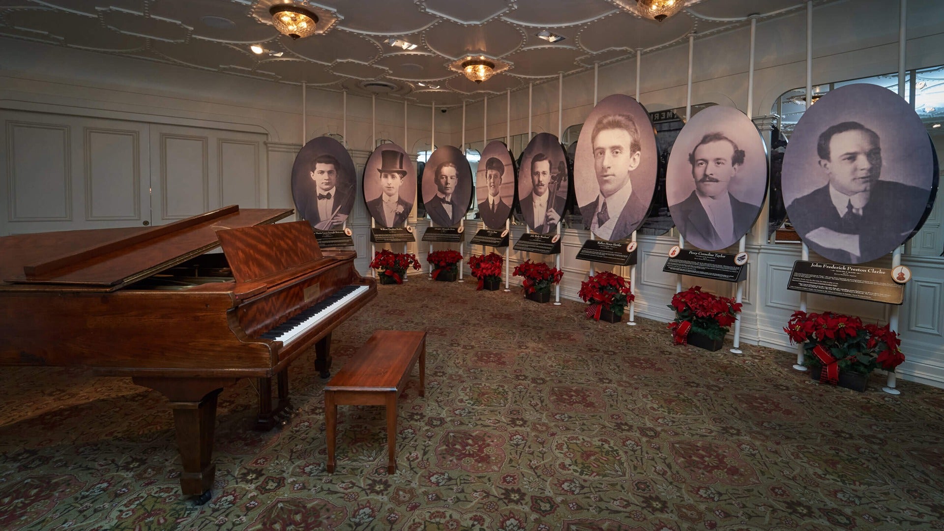 a grand piano with a display of people on the side