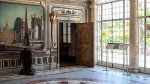 a large ornate room with stained glass windows and signages