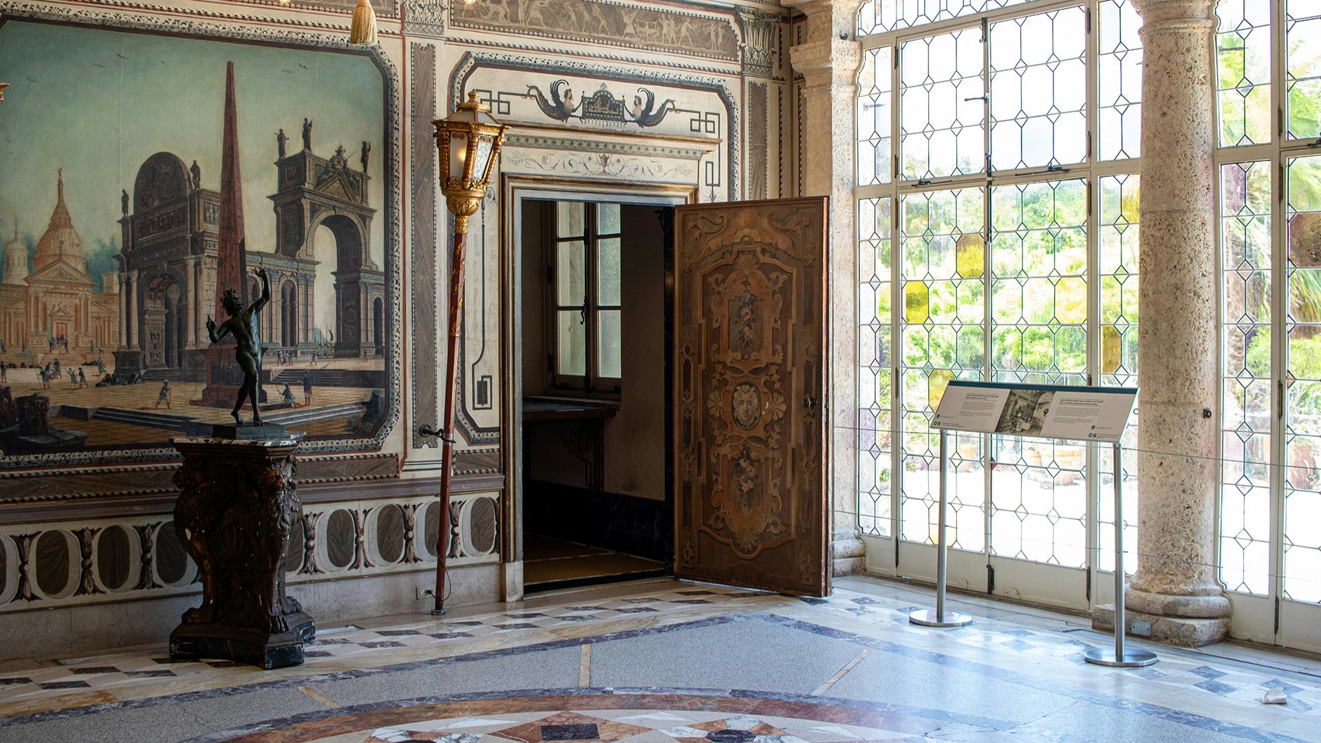 a large ornate room with stained glass windows and signages