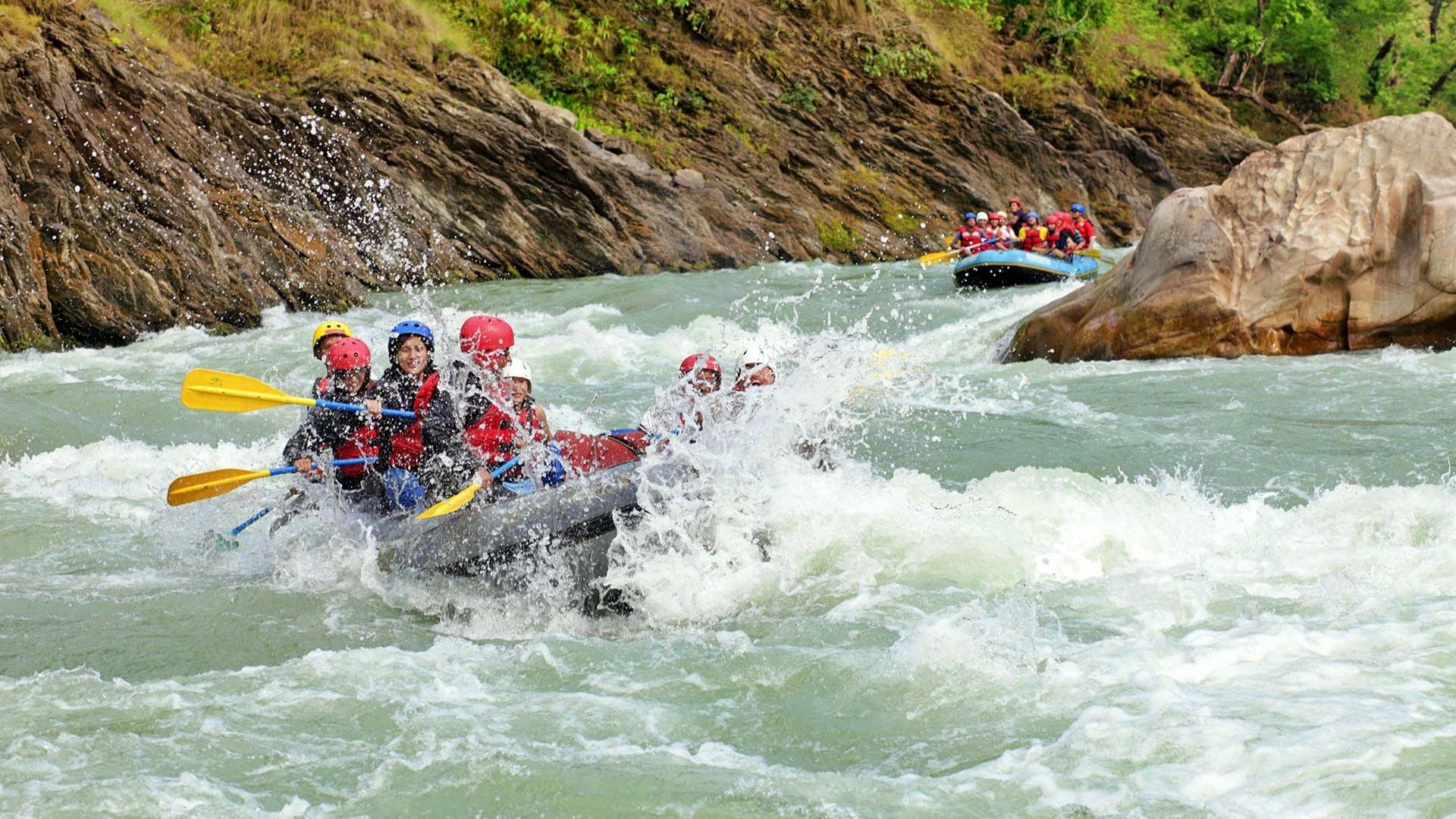 group of people going white water rafting