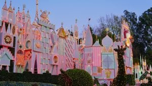 theme park display with lights and symbols and bushes in front