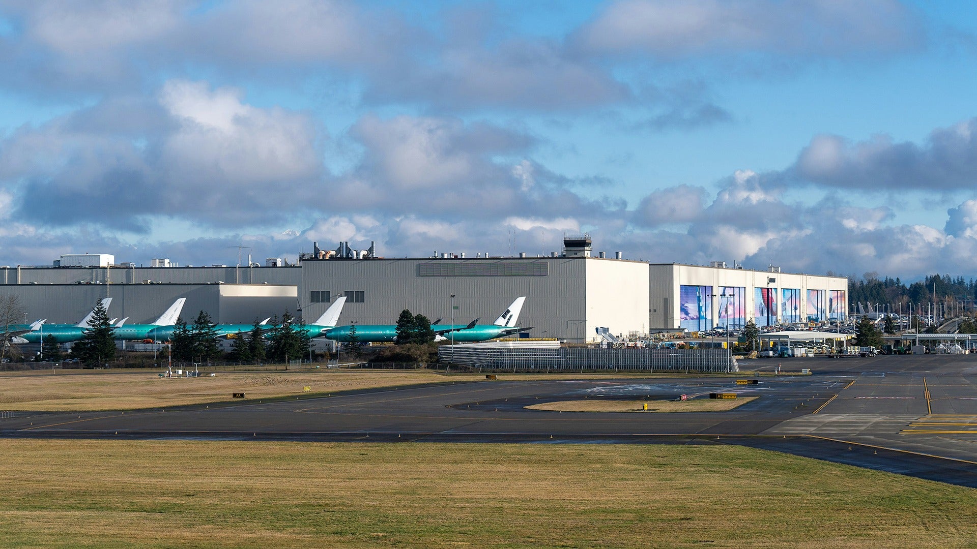 an airport with planes and a tarmac